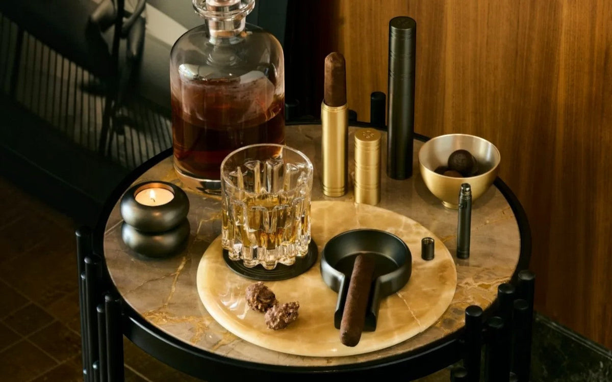 Sculptural brass cigar objects designed for a refined smoking ritual