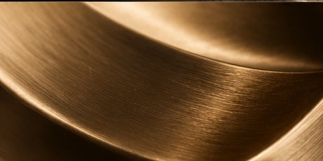 Close-up of the brushed satin gold finish on a Born Brass object