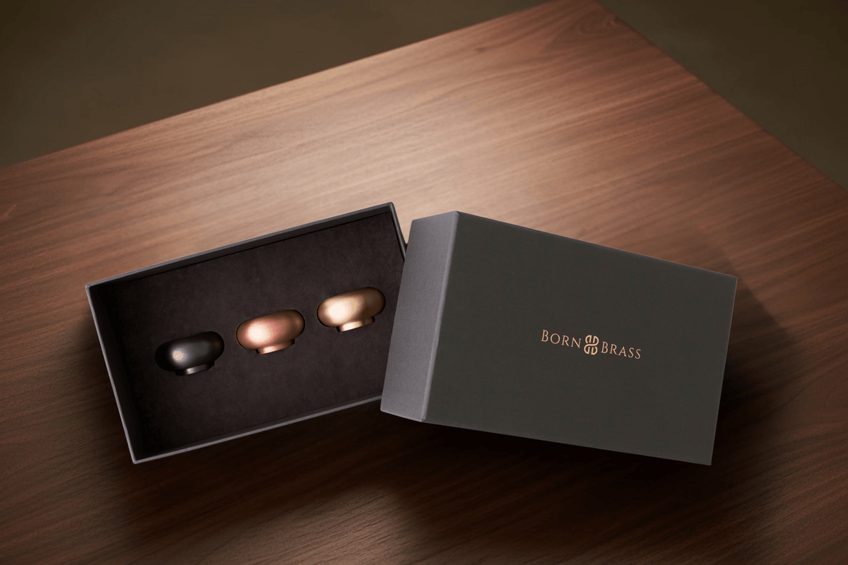 brass tealight holders styled on a contemporary table setting